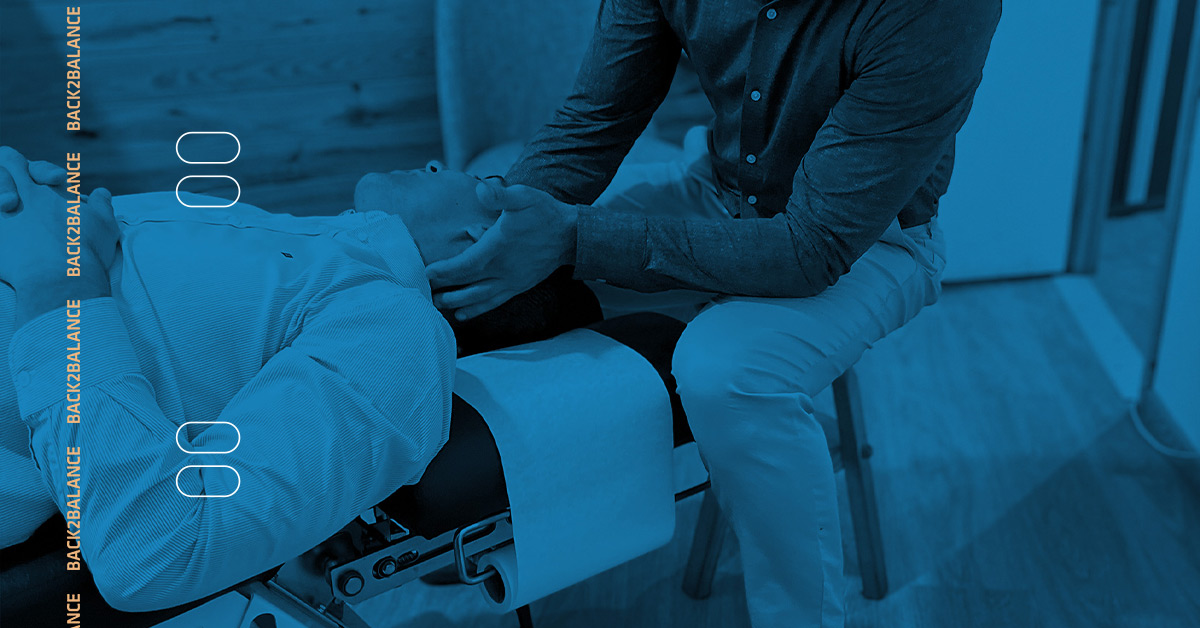 Patient on chiropractic table getting the neck adjusted by a chiropractor